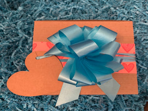 closed ready to gift box with bow and gift tag applied
